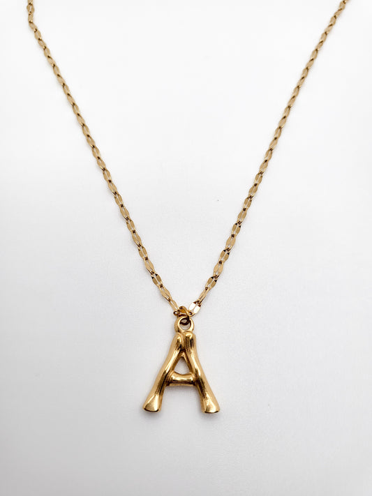 gold plated necklace with bamboo looking like initial letter of your name