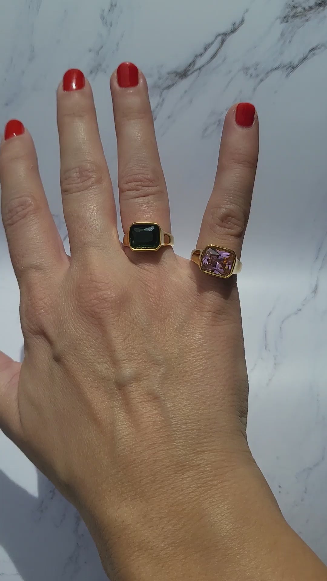 video of gold plated chunky zircon rings in color green and pink