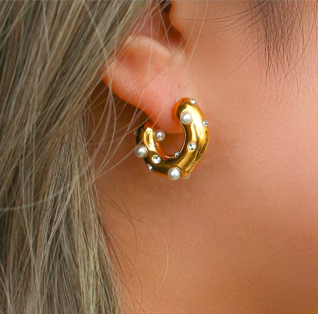 Gold plated pearl hoop earrings on a model